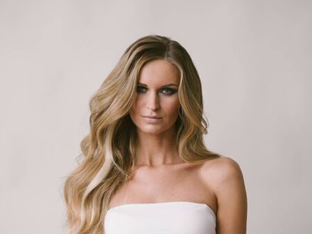 Beautiful woman long hair blonde natural portrait with beauty makeup. Studio shot.の写真素材