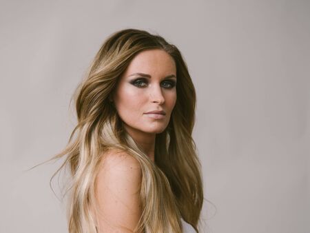 Beautiful woman long hair blonde natural portrait with beauty makeup. Studio shot.の写真素材