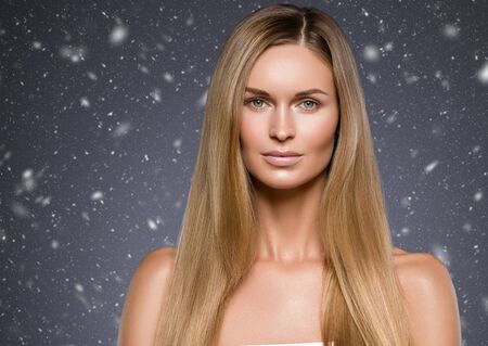 Winter beauty woman face healthy beautiful skin and blond smooth hairの写真素材