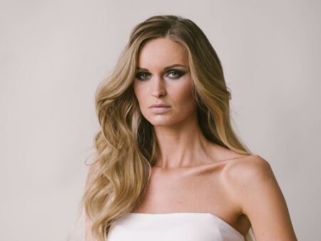 Beautiful woman long hair blonde natural portrait with beauty makeup. Studio shot.の写真素材