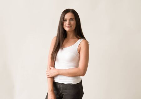 Natural brunette woman long hair casual makeup. Studio shot.の写真素材
