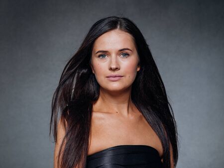 Beautiful woman art concept long brunette hair natural makeup fashion picture. Studio shot.の写真素材