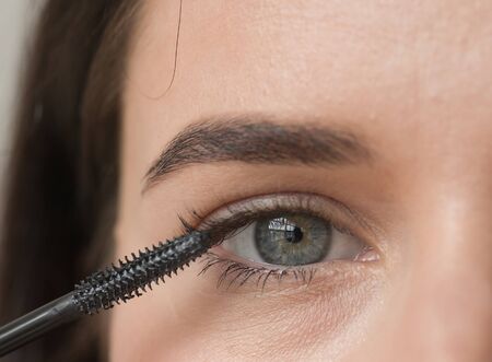 Woman makeup mascara eyes healthy skin natural fashion makeup. Studio shot.の写真素材