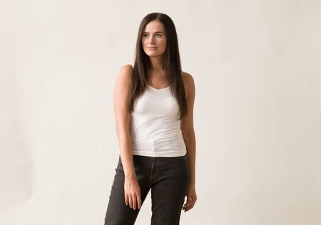 Natural brunette woman long hair casual makeup. Studio shot.の写真素材