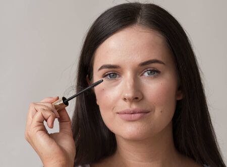 Woman makeup mascara eyes healthy skin natural fashion makeup. Studio shot.の写真素材
