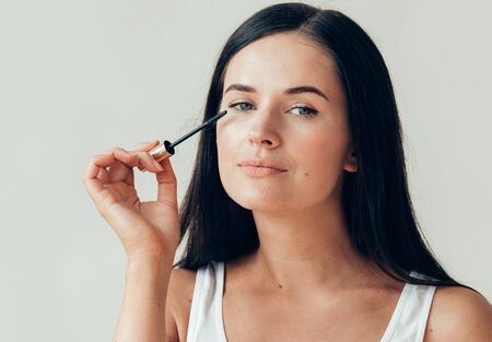 Woman makeup mascara eyes healthy skin natural fashion makeup. Studio shot.の写真素材