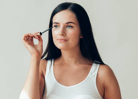 Woman makeup mascara eyes healthy skin natural fashion makeup. Studio shot.の写真素材