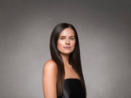 Beautiful woman art concept long brunette hair natural makeup fashion picture. Studio shot.の写真素材