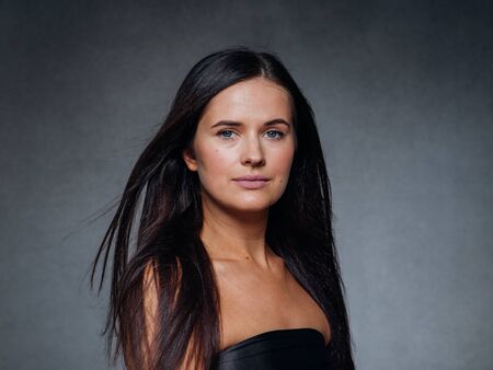 Beautiful woman art concept long brunette hair natural makeup fashion picture. Studio shot.の写真素材