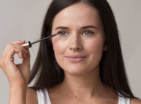 Woman makeup mascara eyes healthy skin natural fashion makeup. Studio shot.の写真素材