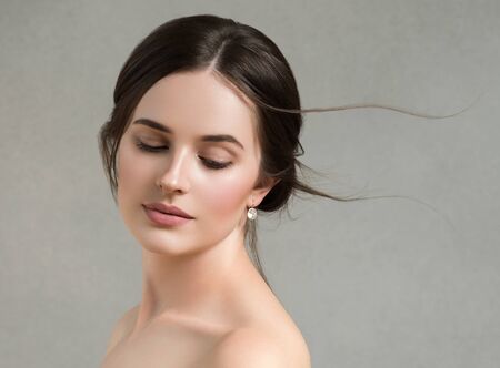 Beautiful woman portrait beauty hair and skin makeup young model. Studio shot.の写真素材