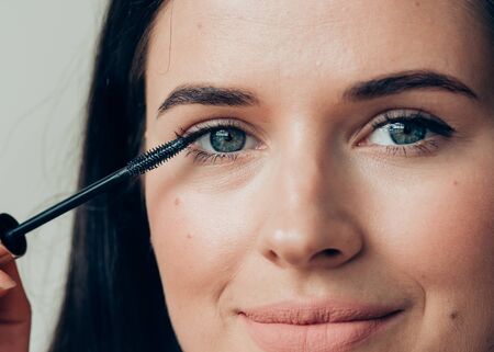 Woman makeup mascara eyes healthy skin natural fashion makeup. Studio shot.の写真素材