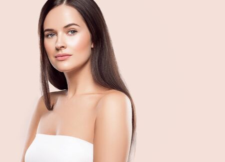 Beauty face woman young beautiful girl Gorgeous female portrait brown hair. Young adult girl with healthy skin fashion eye makeup. Studio shot.の写真素材