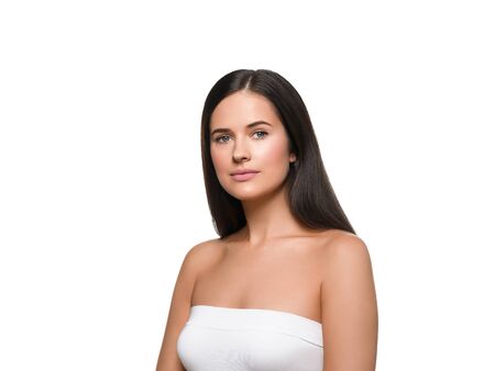 Beauty skin woman face healthy skin beautiful model close up face natural makeup brunette hair. Isolated on white. Studio shot.の写真素材