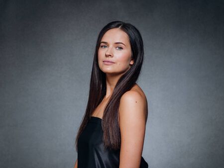 Beautiful woman art concept long brunette hair natural makeup fashion picture. Studio shot.の写真素材