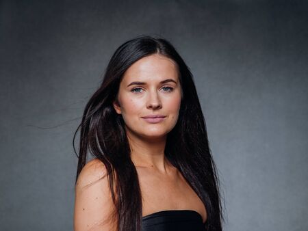Beautiful woman art concept long brunette hair natural makeup fashion picture. Studio shot.の写真素材