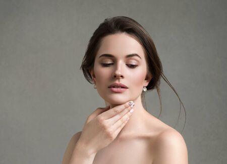 Beautiful woman portrait beauty hair and skin makeup young model. Studio shot.の写真素材