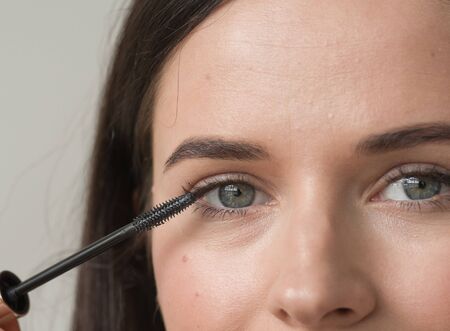 Woman makeup mascara eyes healthy skin natural fashion makeup. Studio shot.の写真素材