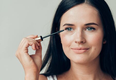 Woman makeup mascara eyes healthy skin natural fashion makeup. Studio shot.の写真素材