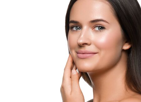Beauty skin woman face healthy skin beautiful model close up face natural makeup brunette hair. Isolated on white. Studio shot.の写真素材