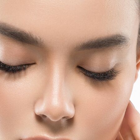 Asia beauty woman  with closed eyes healthy skin face clean fresh skin spa. Studio shot.  Isolated on white.の写真素材
