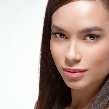 Asian beauty woman face beautiful healthy skin isolated on white.  Studio shot.の写真素材