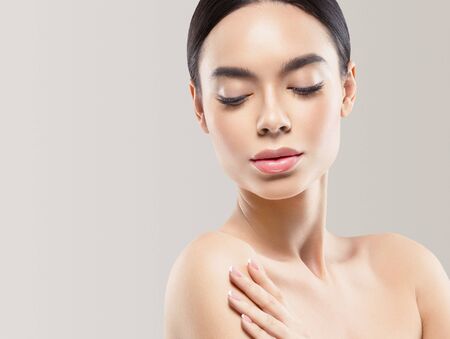 Asia beauty woman  with closed eyes healthy skin face clean fresh skin spa. Studio shot.の写真素材