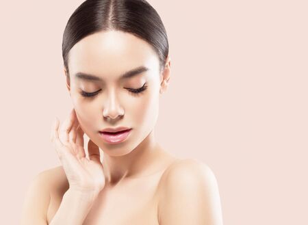 Asia beauty woman  with closed eyes healthy skin face clean fresh skin spa. Studio shot.  Isolated on white.の写真素材