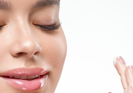Asia beauty woman  with closed eyes healthy skin face clean fresh skin spa. Studio shot.  Isolated on white.の写真素材