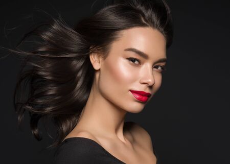 Red lips woman beauty face asian female. Studio shot.の写真素材