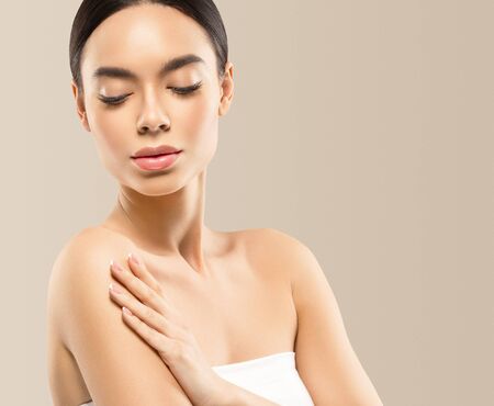 Asia beauty woman  with closed eyes healthy skin face clean fresh skin spa. Studio shot.の写真素材