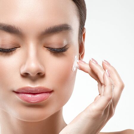 Asia beauty woman healthy skin face clean fresh skin spa. Studio shot. Isolated on white.の写真素材