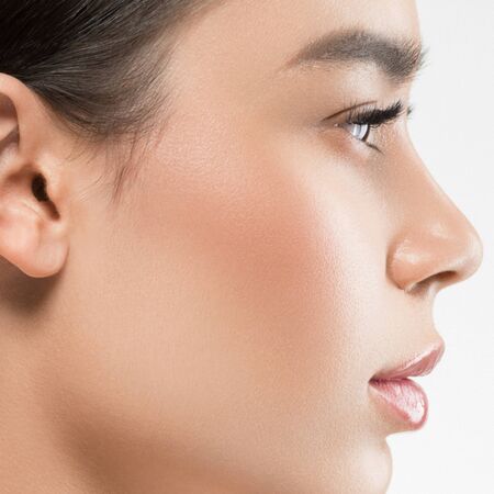 Asian beauty profile woman healthy skin natural makeup isolated on white cosmetic beautiful portrait. Studio shot.の写真素材