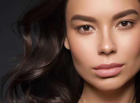 Red lips woman beauty face asian female. Studio shot.の写真素材