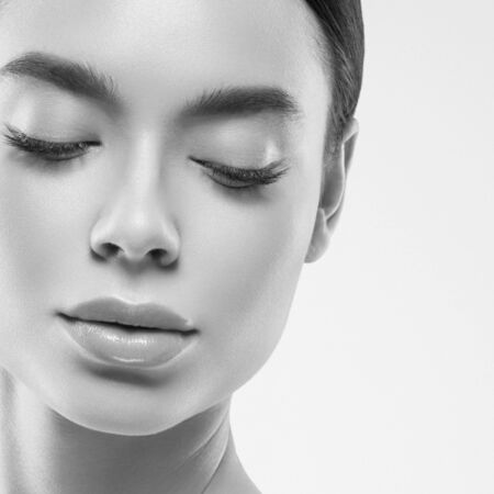 Asia beauty woman healthy skin face clean fresh skin spa. Studio shot.  Monochrome. Gray. Black and white.の写真素材