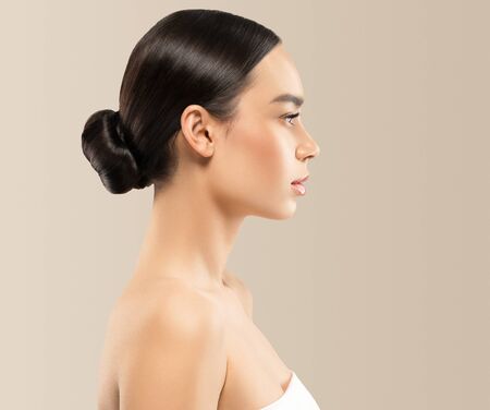 Asian beauty profile woman healthy skin natural makeup isolated on white cosmetic beautiful portrait. Studio shot.の写真素材