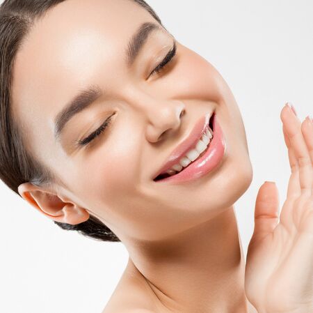 Asia beauty woman  with closed eyes healthy skin face clean fresh skin spa. Studio shot.  Isolated on white.の写真素材