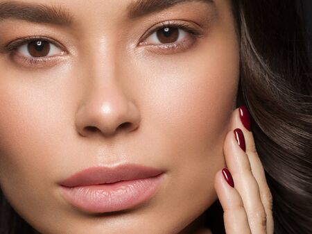 Red lips woman beauty face asian female. Studio shot.の写真素材