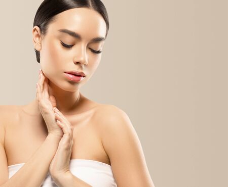 Asia beauty woman  with closed eyes healthy skin face clean fresh skin spa. Studio shot. Color background.の写真素材