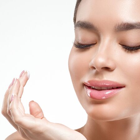 Asia beauty woman  with closed eyes healthy skin face clean fresh skin spa. Studio shot.  Isolated on white.の写真素材