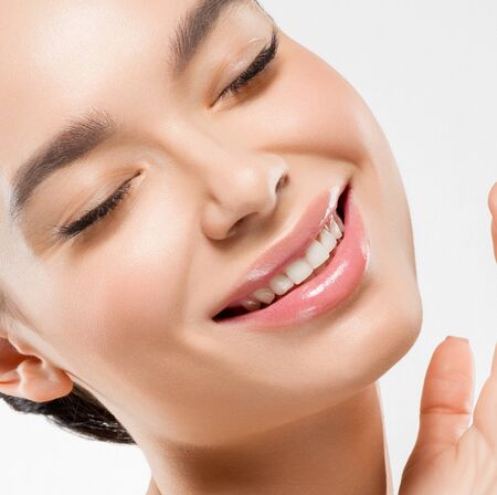 Asia beauty woman  with closed eyes healthy skin face clean fresh skin spa. Studio shot.  Isolated on white.の写真素材
