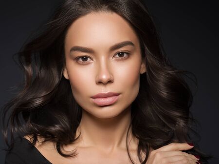Red lips woman beauty face asian female. Studio shot.の写真素材