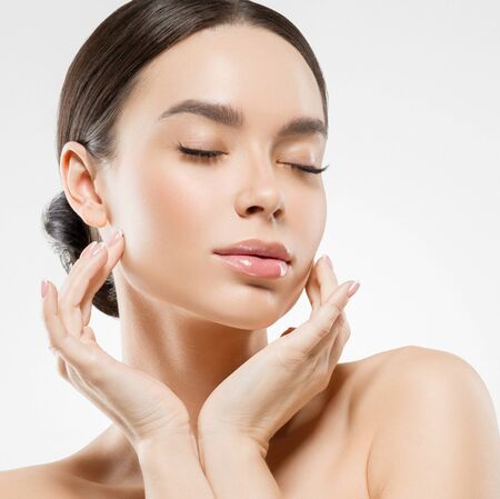 Asia beauty woman  with closed eyes healthy skin face clean fresh skin spa. Studio shot.  Isolated on white.の写真素材