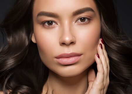 Red lips woman beauty face asian female. Studio shot.の写真素材