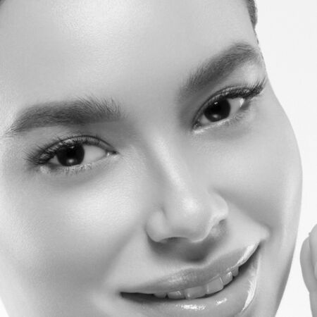Asia beauty woman healthy skin face clean fresh skin spa. Studio shot.  Monochrome. Gray. Black and white.の写真素材