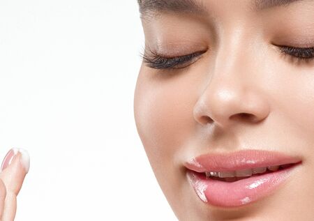 Asia beauty woman  with closed eyes healthy skin face clean fresh skin spa. Studio shot.  Isolated on white.の写真素材