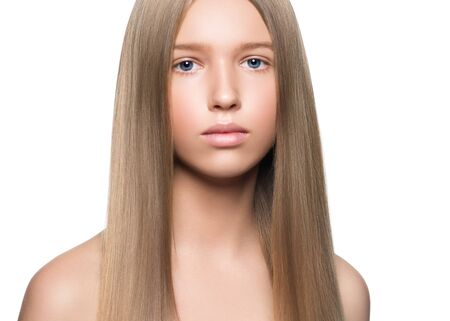 Long smooth hair clean skin girl healthy skin care natural makeup female portrait isolated on white. Studio shot.の写真素材