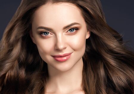 Beauty hair woman curly hairstyle natural makeup. Studio shot.の写真素材