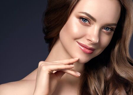 Beauty hair woman curly hairstyle natural makeup. Studio shot.の写真素材