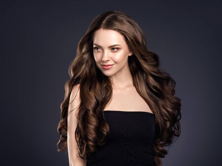 Beauty hair woman curly hairstyle natural makeup. Studio shot.の写真素材